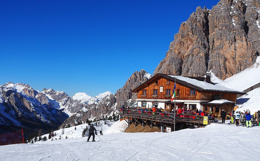 in the ski area under the Cristallo above Cortina d´Ampezzo, ski slope, snow, skier, landscape, ski hut, Dolomites, winter in Veneto, Italy
