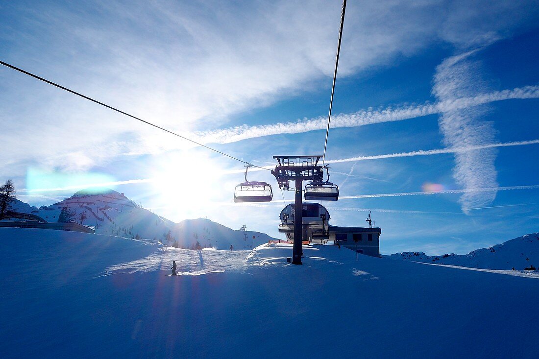 In the ski area Zauchensee, Sportwelt Amadé, mountains, chair lift, clouds, sky, ski slope, winter in Salzburg, Austria