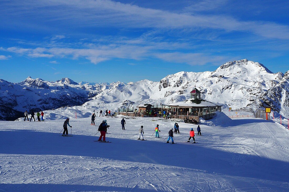 In Obertauern, ski area, pass, snow, sun, ski slopes, skiers, winter in Salzburg, Austria