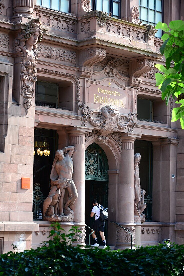 University library, students, entrance, figure, old town of Heidelberg am Neckar, Baden-Württemberg, Germany