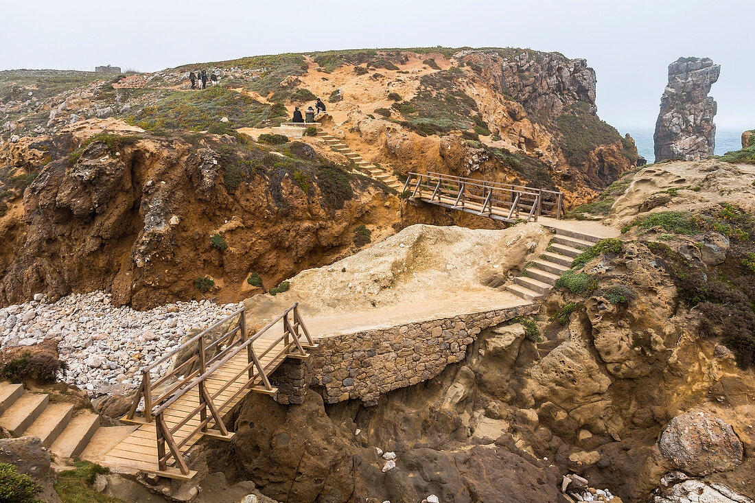 Rock formations &quot;Papoa&quot; on Peniche peninsula in light fog, Peniche, Portugal