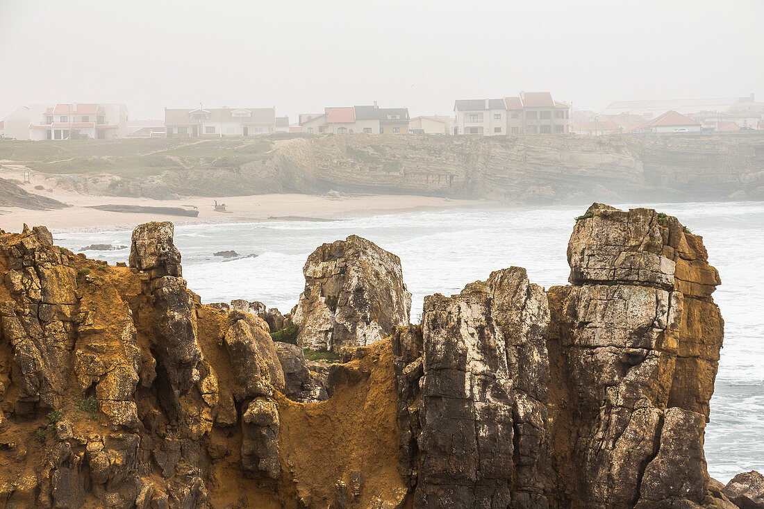 Rock formations &quot;Papoa&quot; on Peniche peninsula in light fog, Peniche, Portugal
