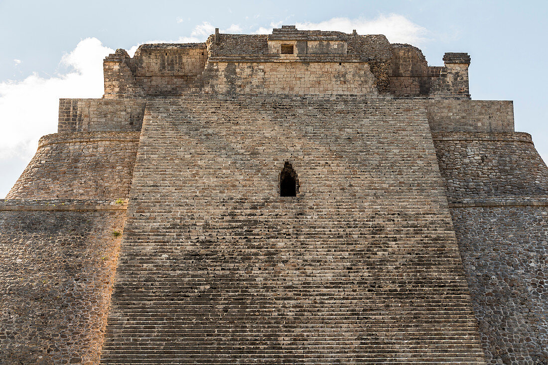 Pyramid of the magician in ancient Maya city Uxmal, Yucatan, Mexico