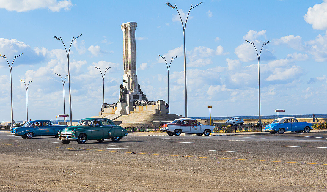 Vintage cars at the &quot;Monumento al Maine&quot; on the Malecon waterfront. Old Havana, Cuba