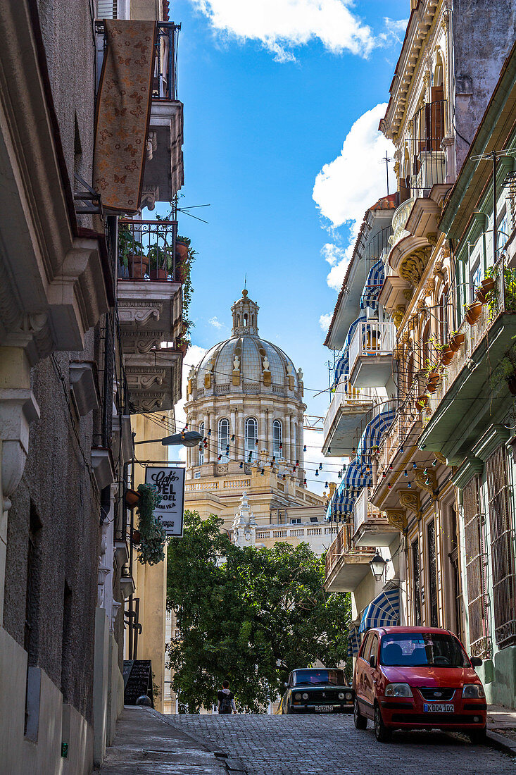 Cuban alley with colonial houses and view of Capitol, Old Havana, Cuba