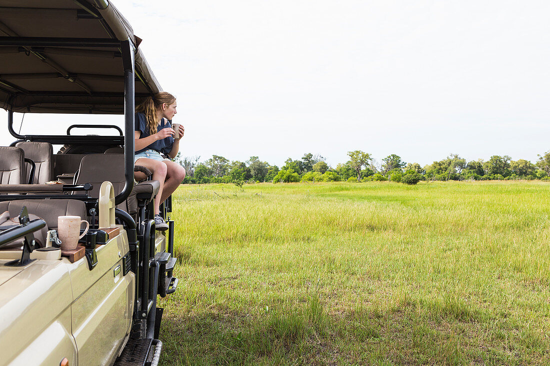 13 year old girl on safari vehicle, Botswana