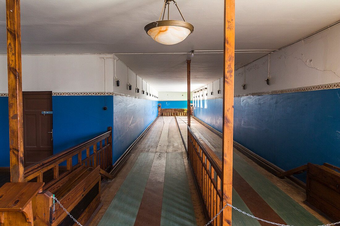 Bowling alley in ghost town Kolmannskuppe on tour on Wednesday, near Lüderitz, Namibia