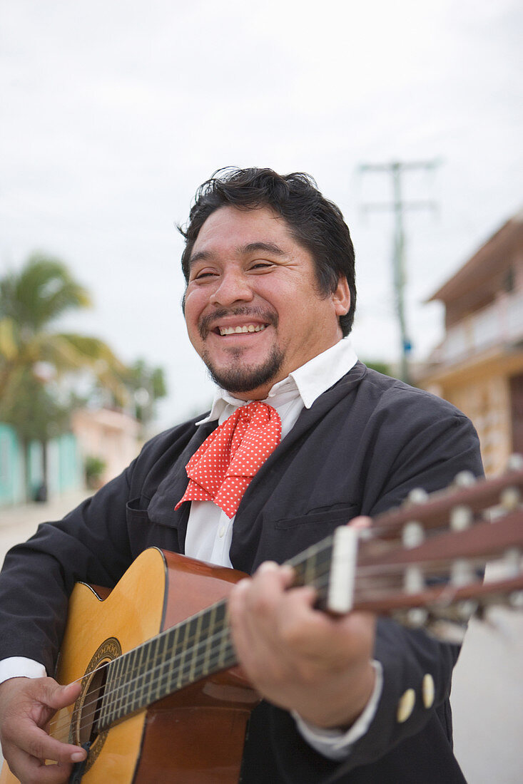 Mariachi player with guitar – License image – 71337262 lookphotos