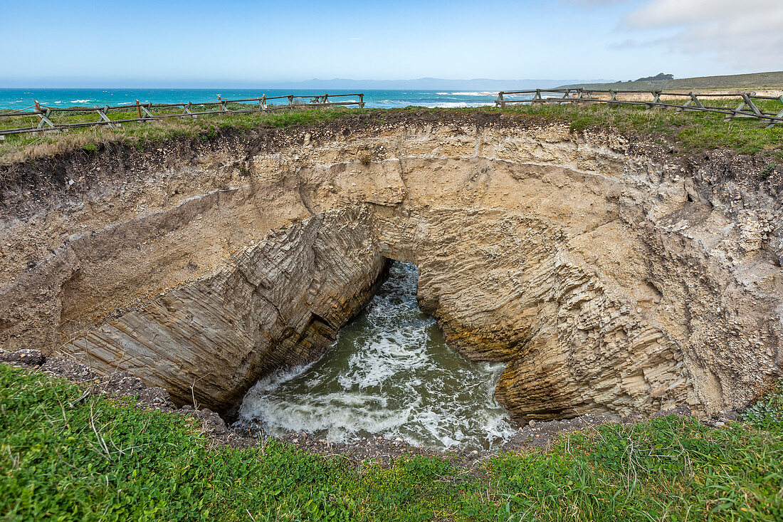 USA, California, San Luis Obispo, Sinkhole at edge of coastal bluff