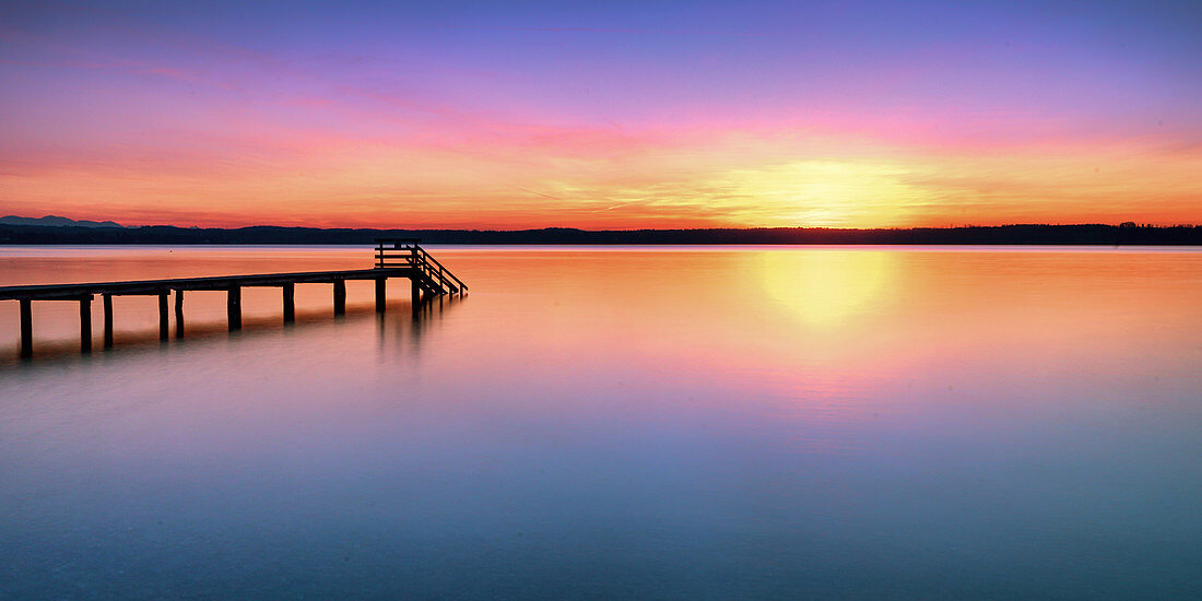 Jetty at sunset on Lake Starnberg, Bavaria, Germany