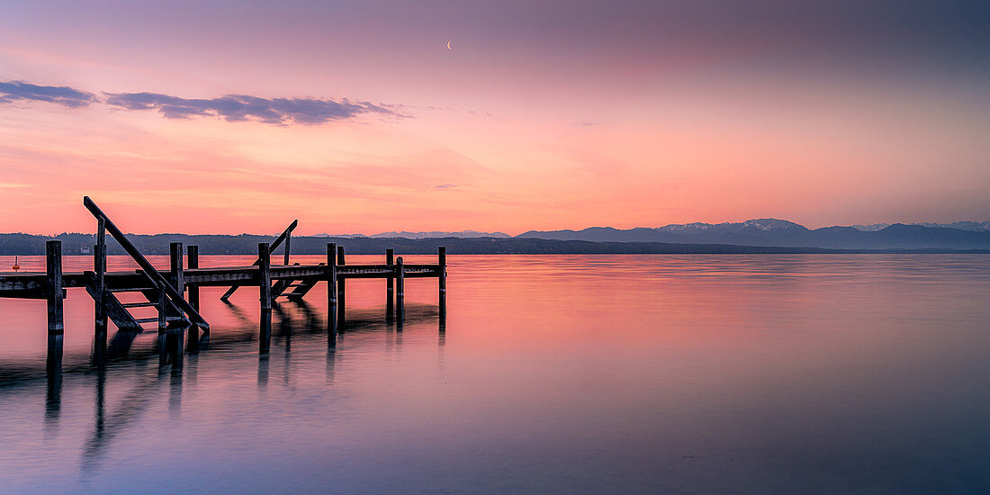 Jetty at sunrise on Lake Starnberg, Bavaria, Germany