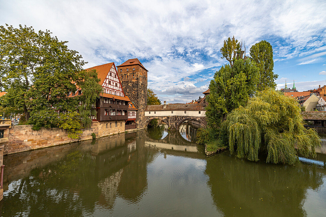 View from Maxbrücke to the Pegnitz (river) and the Henkerbrücke with water tower in the afternoon, Nuremberg city center, Franconia, Bavaria, Germany