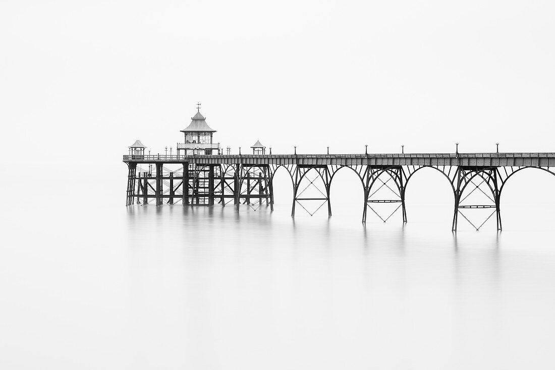 Black and white photograph of Clevedon Pier in the Severn Estuary on the North Somerset coast, England.