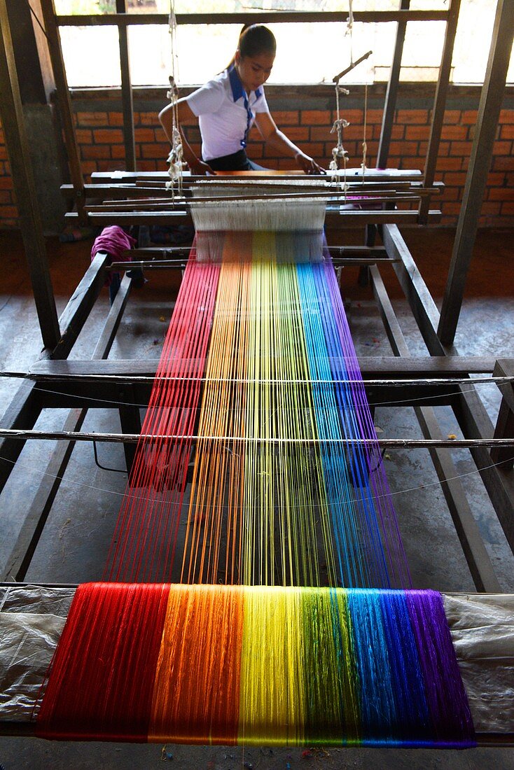 Woman working in a traditional silk factory,Stung Treng,Cambodia,South East Asia.