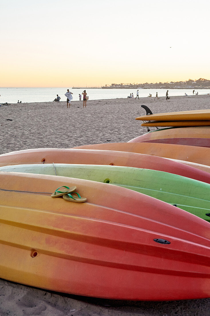 Surfboards on Santa Barbara Beach in the evening light, California, USA.