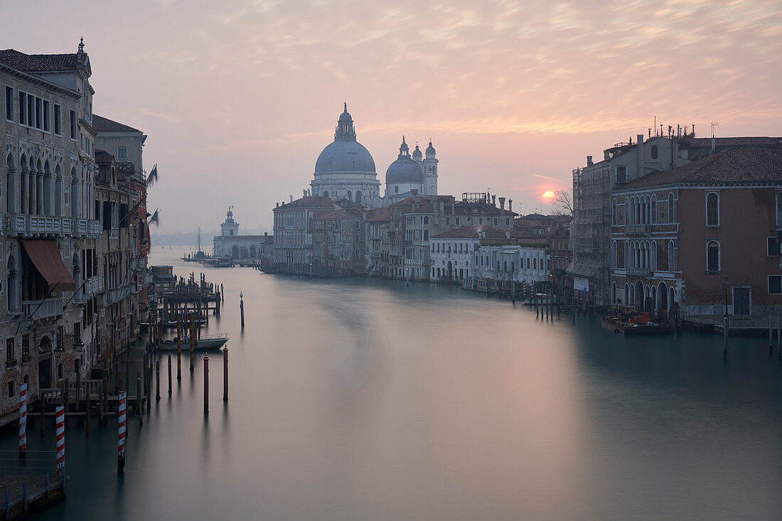 Sunrise from the Accademia Bridge looking towards Santa Maria della Salute, Venice, Italy.