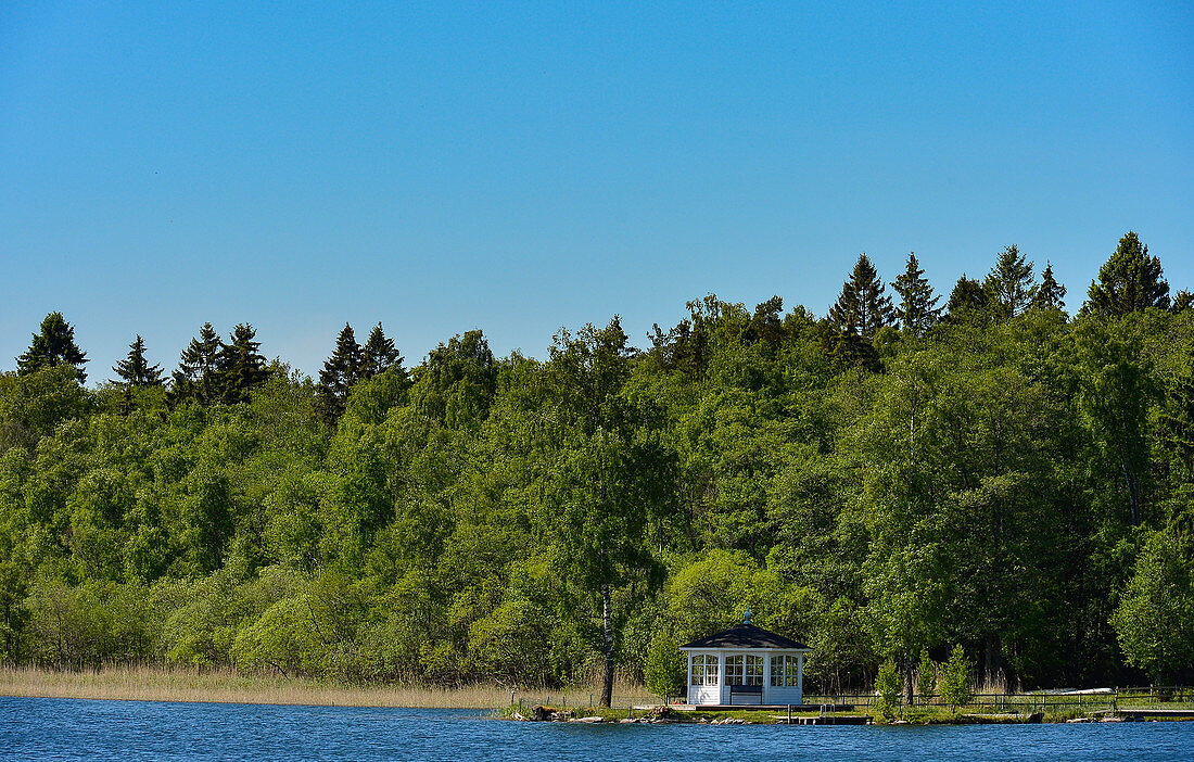 A small pavilion right on a lake near Borrud, Västergötland, Sweden