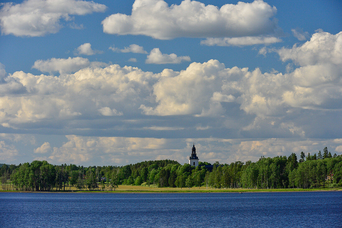 View of the church with forest by the lake, Bäsingen, Sjövik, Dalarna, Sweden