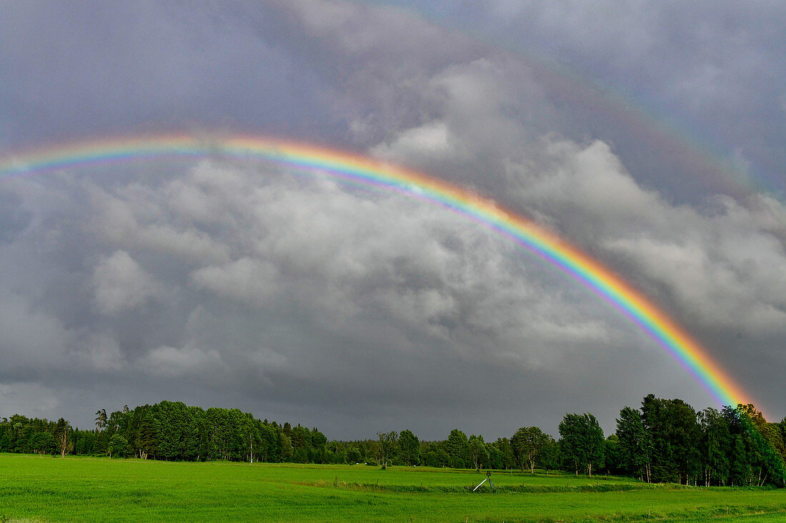 Strong rainbow over the landscape, near Sävsjö, Jönköpings Län, Sweden