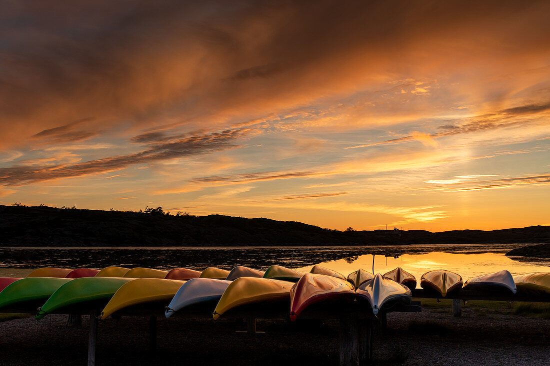 Canoes on Ellös Beach in the evening light, Orust, Bohuslän, Sweden