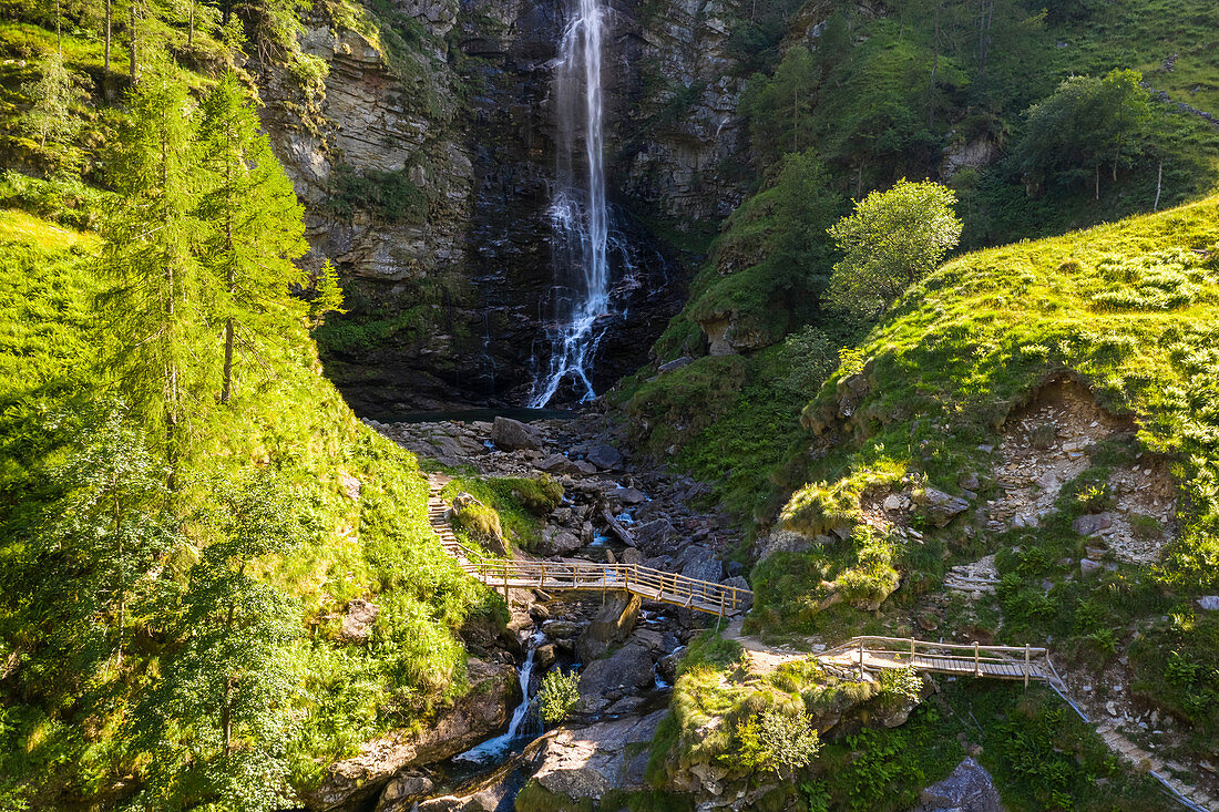 Wooden bridge under the Cascata della Froda, Sonogno, Valle Verzasca, Canton Ticino, Switzerland.