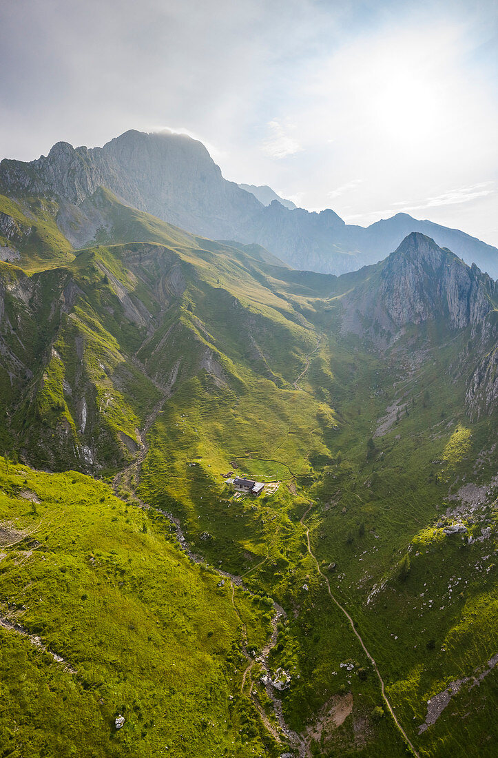 Aerial view of Rino Olmo refuge and Passo Olone with Pizzo della Presolana. Castione della Presolana, Bergamo province, upper Val Seriana, Lombardy, Italy.