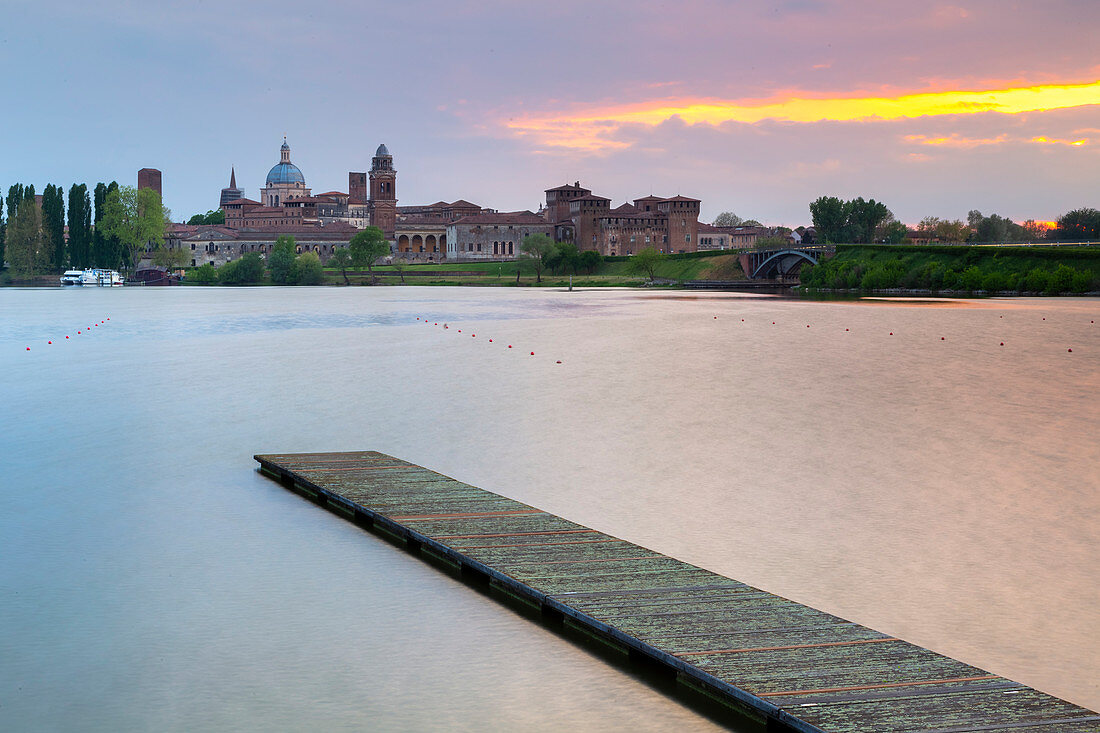 View of the medieval city of Mantua at sunset with Castello di San Giorgio, Palazzo Ducale and the dome of the Basilica of Sant'Andrea. Mantua, Lombardy, northern Italy, southern europe.