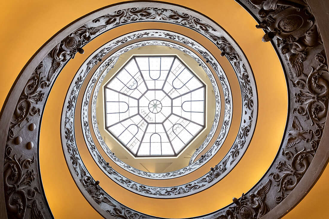 View of the Bramante Staircase, spiral stairs of the Vatican Museums and its skylight from below. Rome, Rome district, Lazio, Europe, Italy.