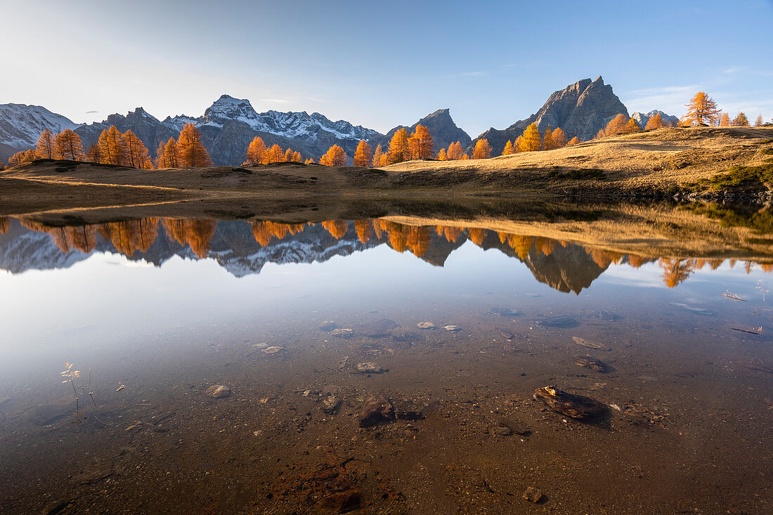 Autumnal view at sunset of the mountains surrounding Alpe Devero from the Laghi del Sangiatto. Antigorio valley, Piedmont, Italy.