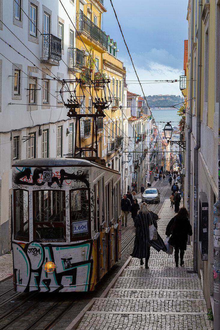 A typical cable car on the streets of Lisbon traveling to Bairro Alto. Lisbon, Portugal, Europe.