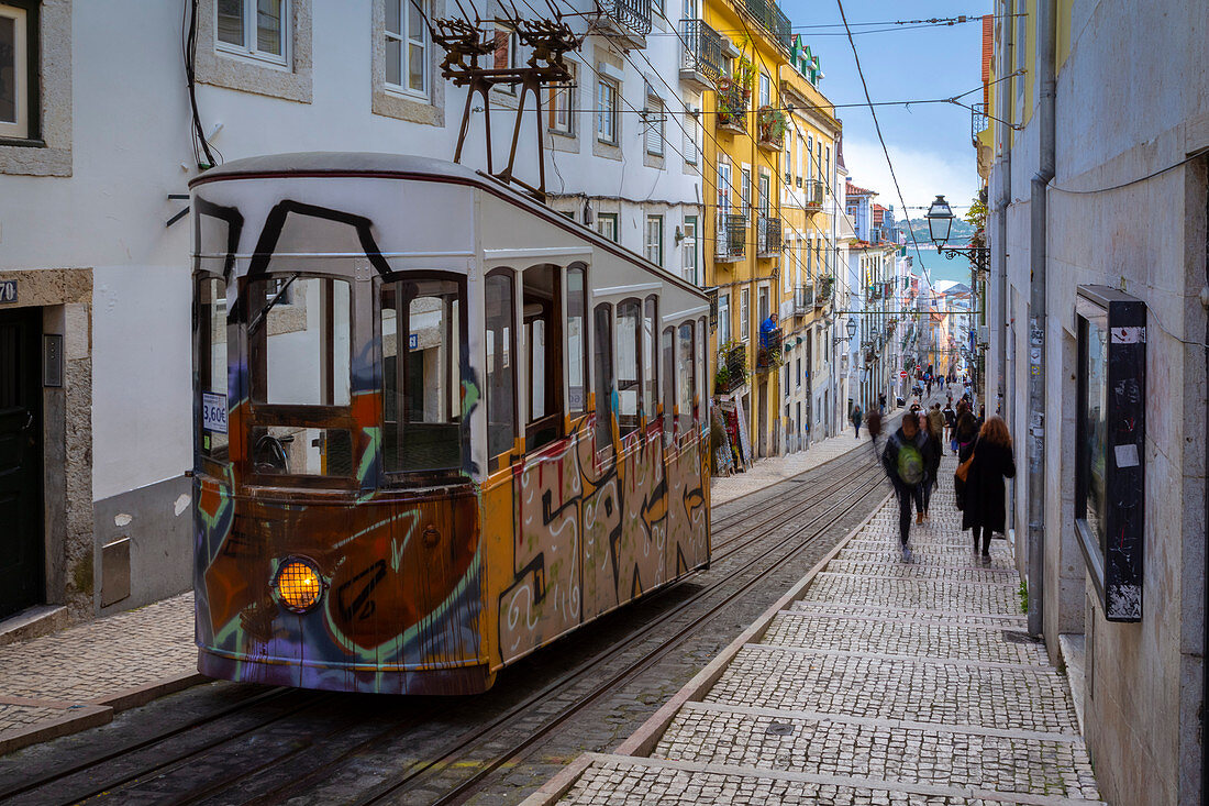 A typical cable car on the streets of Lisbon traveling to Bairro Alto. Lisbon, Portugal, Europe.