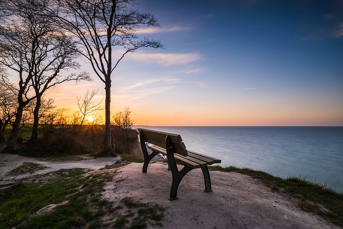 Bench with a view of the Baltic Sea in the evening, Weissenhäuser Strand, Ostholstein, Schleswig-Holstein, Germany