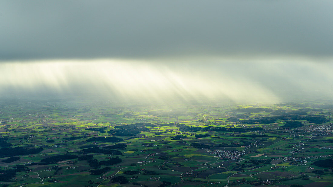 Rain showers in the back light, aerial view, Bavaria, Germany