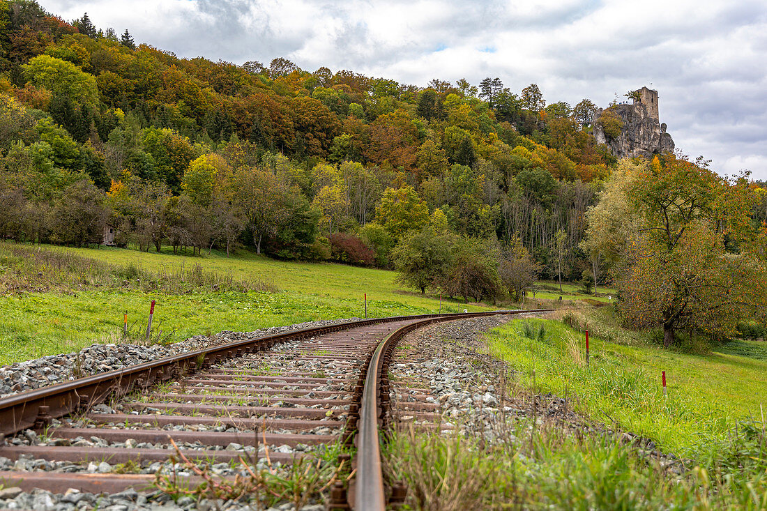 Railway track below the Neideck ruin in autumn, Streitberg, Upper Franconia, Bavaria, Germany