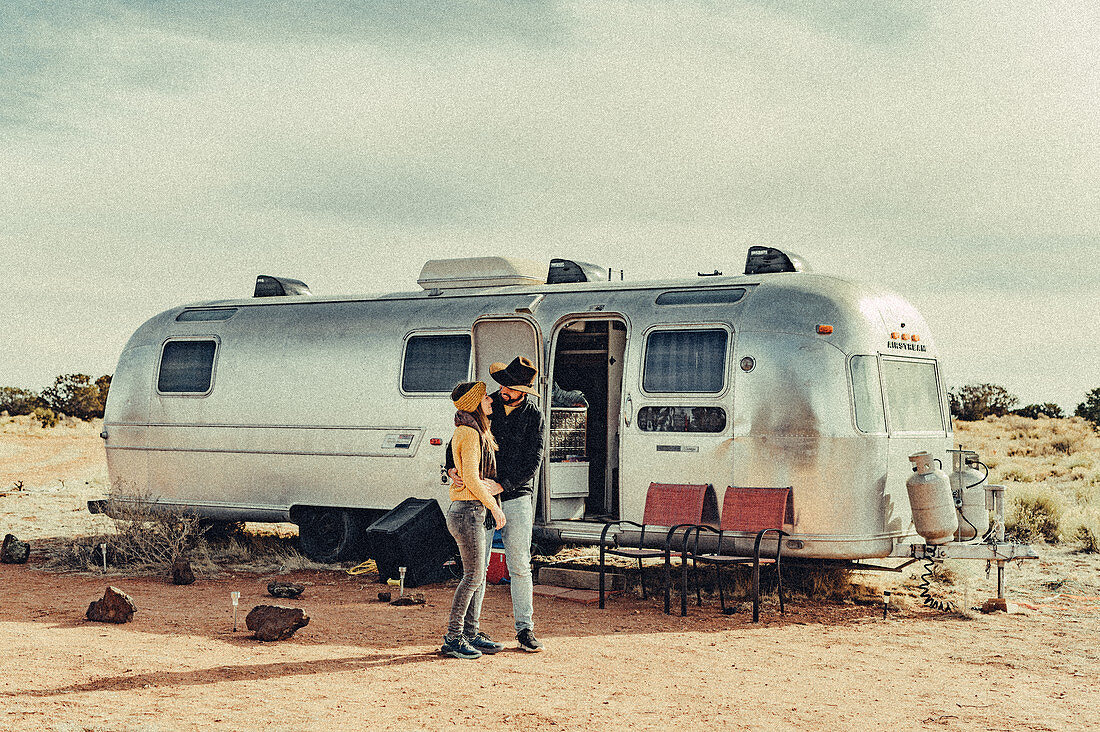 Couple hugging in front of Airstream in Flagstaff, Grand Canyon, Arizona, USA, North America