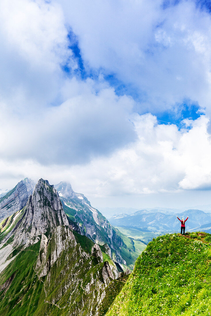 A girl looks stunning mountains, Canton of Appenzell, Alpstein, Switzerland, Europe