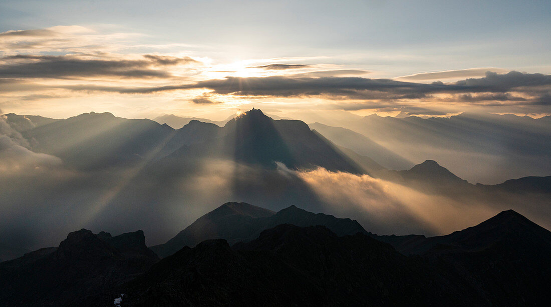 Mountain sunrise in the italian Alps during summer season. Campana peak, Valgrosina valley, Grosio, Valtellina, Sondrio district, Lombardy, Italy, Europe.