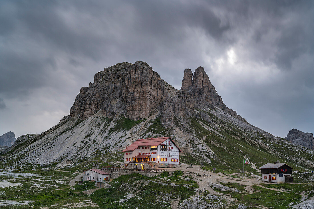 Locatelli hut with Sesto Rock and Toblin Tower at dusk in summer. Sesto Dolomites, Trentino Alto Adige, Italy.