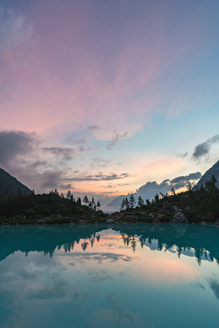 Sunset clouds over Sorapis Lake in summer. Cortina d'Ampezzo, Belluno province, Veneto, Italy.