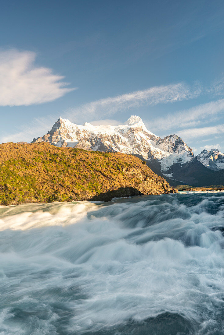 Salto Grande waterfall in the morning with Cerro Paine Grande peaks. Torres del Paine National Park, Ultima Esperanza province, Chile.