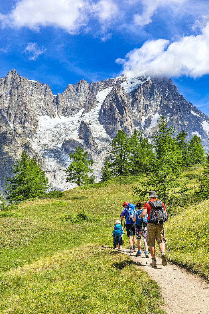 A group of trekkers are walking to the Bonatti Refuge during the Mont Blanc hiking tours (Ferret Valley, Courmayeur, Aosta province, Aosta Valley, Italy, Europe) 