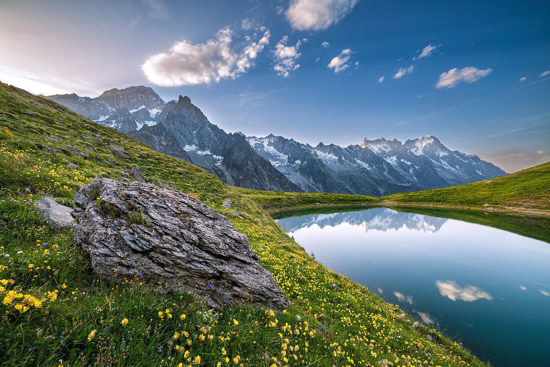 The Mont Blanc Massif reflected in the Checrouit Lake at sunset during the Mont Blanc hiking tours (Veny Valley, Courmayeur, Aosta province, Aosta Valley, Italy, Europe) 