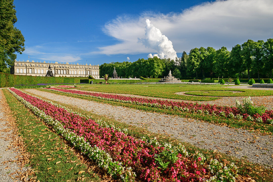 Park with flower borders and Herrenchiemsee Palace, Herrenchiemsee, Chiemsee, Upper Bavaria, Bavaria, Germany