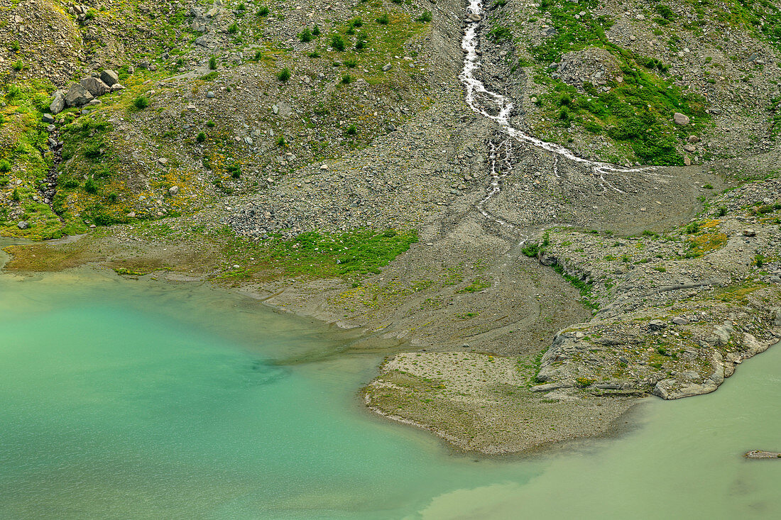 Brook flows into the Pasterze glacier lake, Glockner Group, Hohe Tauern, Hohe Tauern National Park, Carinthia, Austria