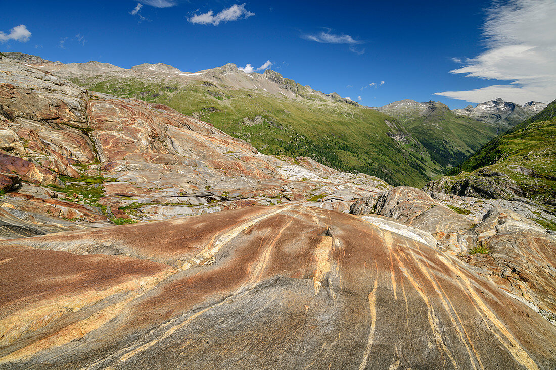Banded rock in the glacier cut terrain, Hohe Tauern in the background, Venediger Group, Hohe Tauern, Hohe Tauern National Park, East Tyrol, Austria