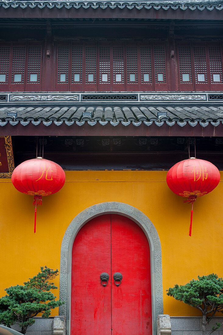Exterior of the Jade Buddha Temple with red lanterns, a Buddhist temple in Shanghai, China.