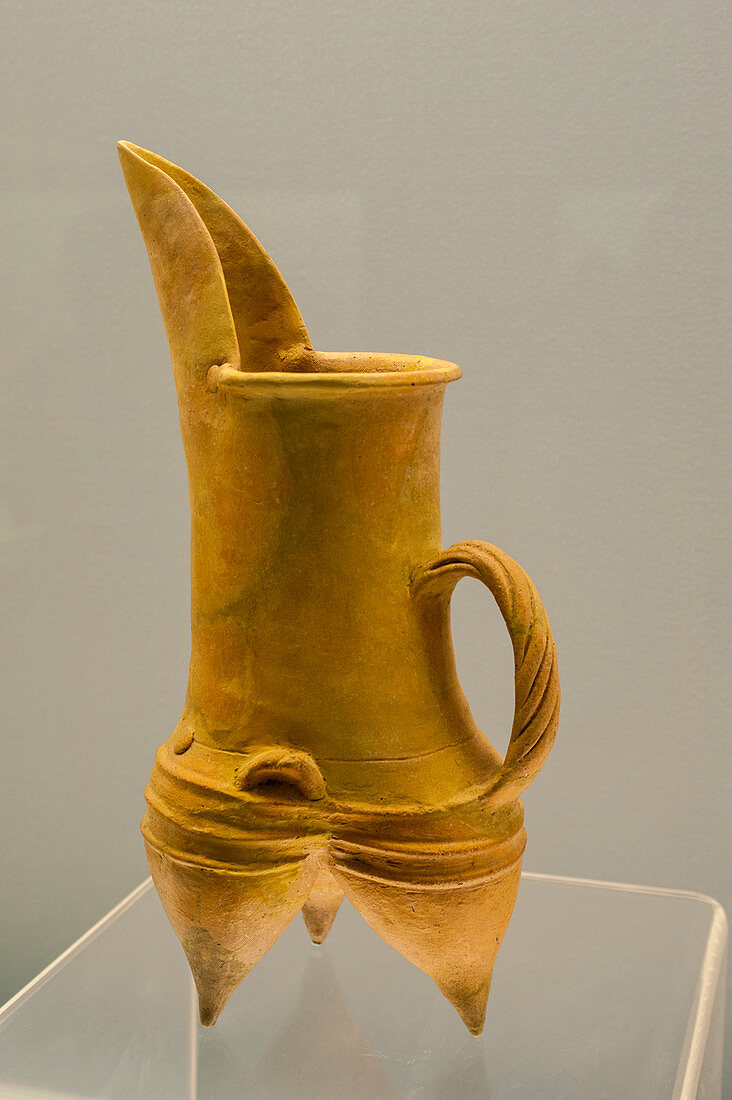 Pottery from 2400 BC in an exhibit at the Shanghai Museum, a museum of ancient Chinese art, situated on the Peoples Square in the Huangpu District of Shanghai, China.