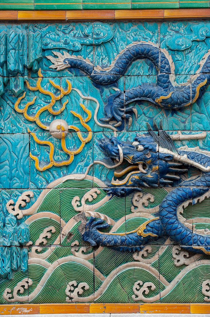 Detail of a dragon at the Nine-Dragon Wall (Nine-Dragon Screen) at the Forbidden City, in Beijing, China.