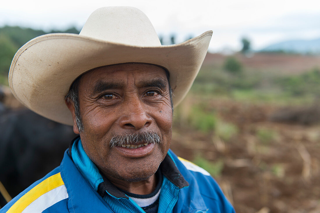 Portrait of a farmer in a field near the Mixtec village of San Juan Contreras near Oaxaca, Mexico.