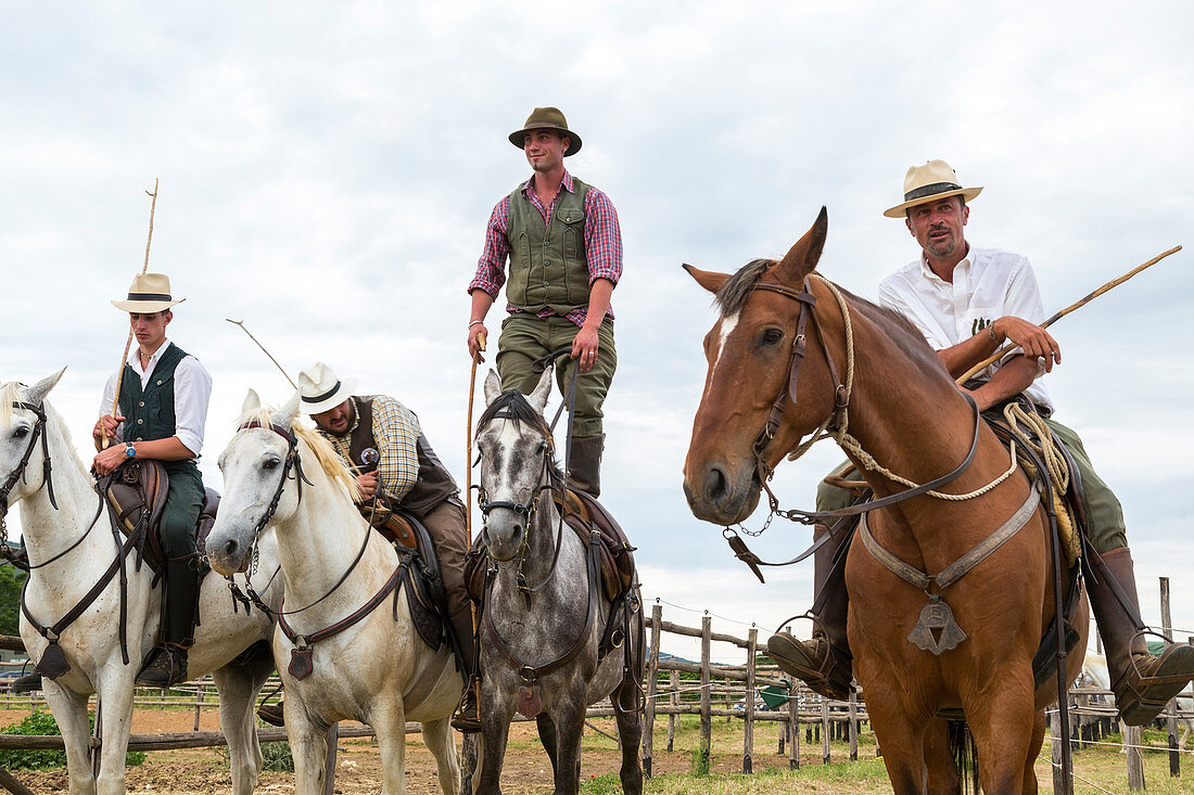 Tuscany, Italy - May 25, 2014: Men riding horses in Tuscany